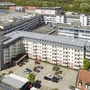 Luftaufnahme des Best Western Hotels in Nürnberg mit umliegenden Gebäuden und Parkplatz.
